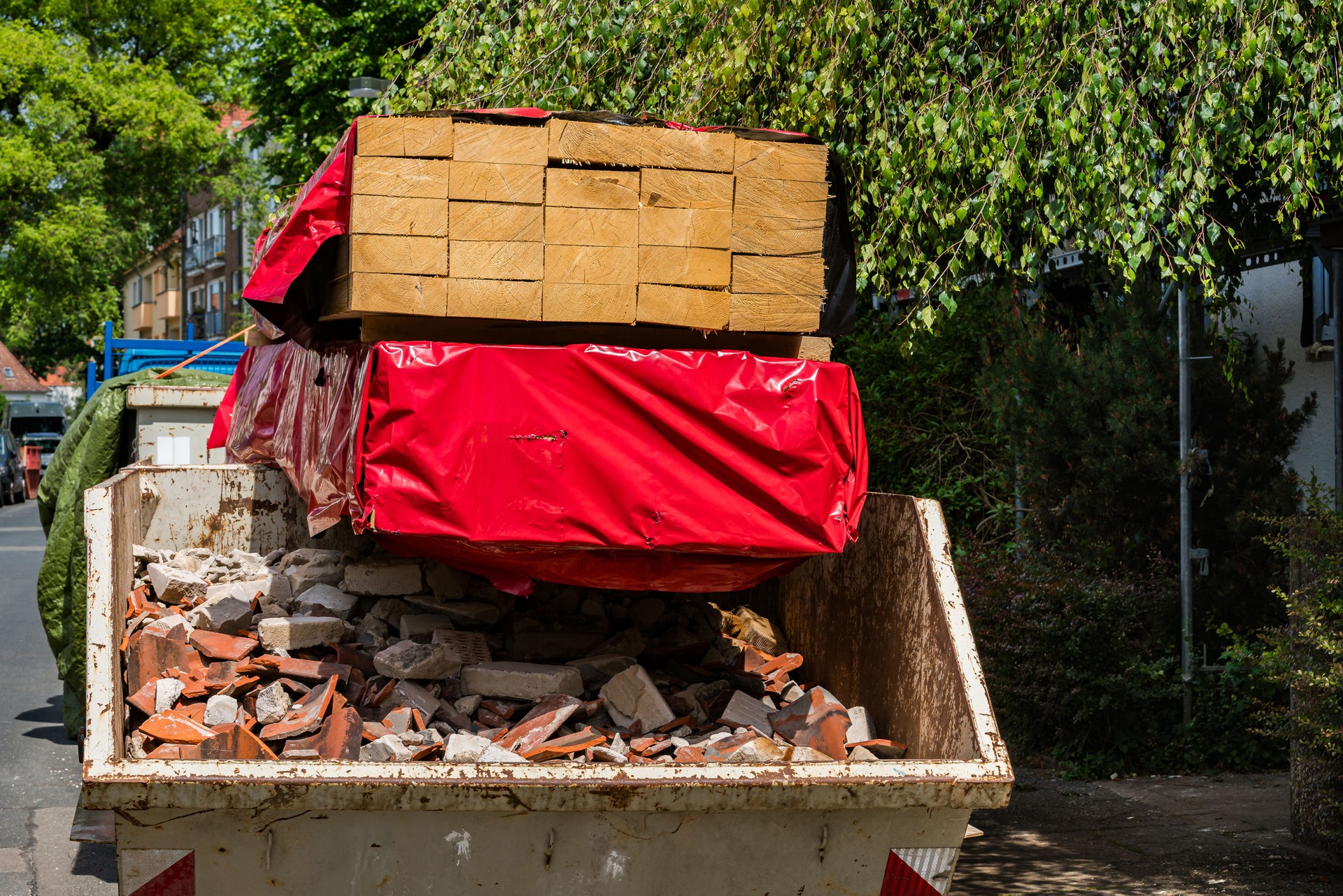 Construction debris removal in urban area on a sunny day